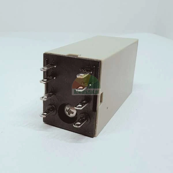 Electromagnetic relay with eight terminals and beige housing on a white background