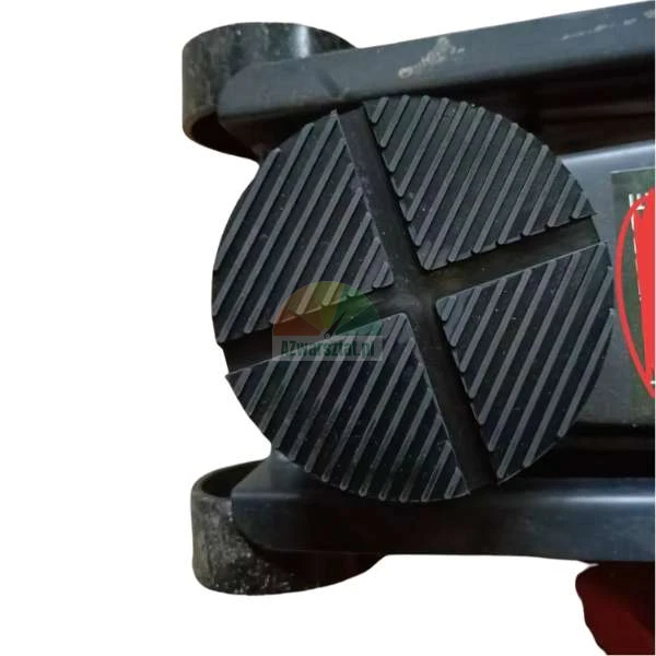 Black rubber jack pad for a hydraulic floor jack with a textured grip surface.