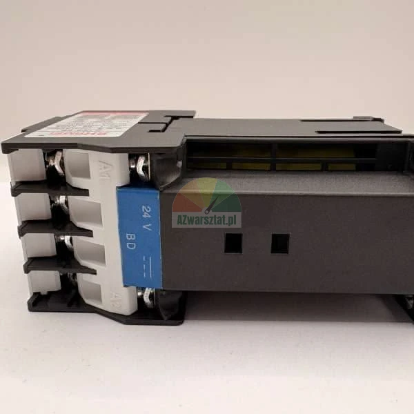 Side view of a black and white industrial contactor with terminal screws and a blue label marked 24V BD.