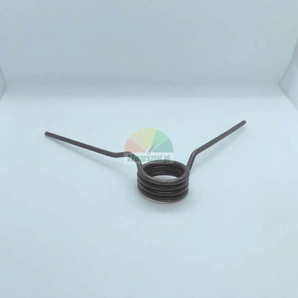 Metal torsion spring made of steel wire on a light background.