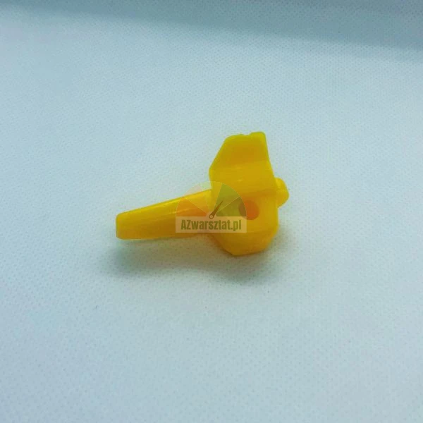 Small yellow plastic mechanism component with a hole for an axle.