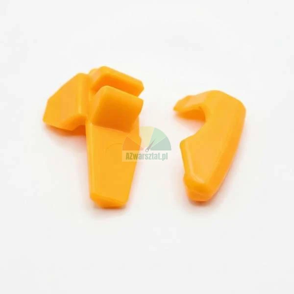 Two orange plastic spare parts or clips on a white background.