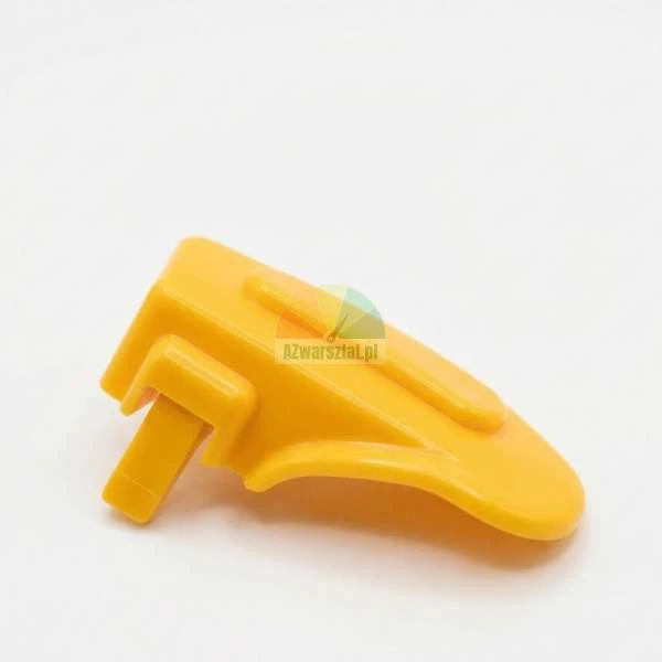 Yellow plastic replacement part, latch or button for a household appliance on a white background.