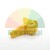 Yellow plastic latch component or safety lock for industrial applications.