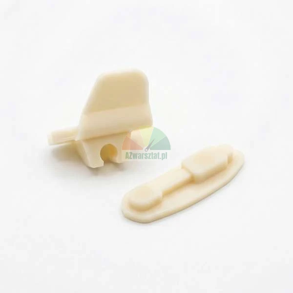 Two beige plastic mounting components on a light background.
