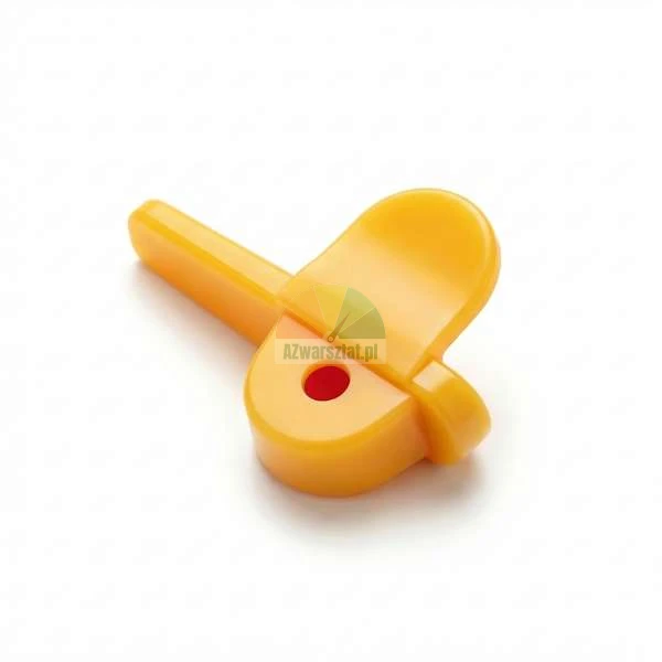 Yellow plastic component of a safety lock for cabinets or drawers on a white background.