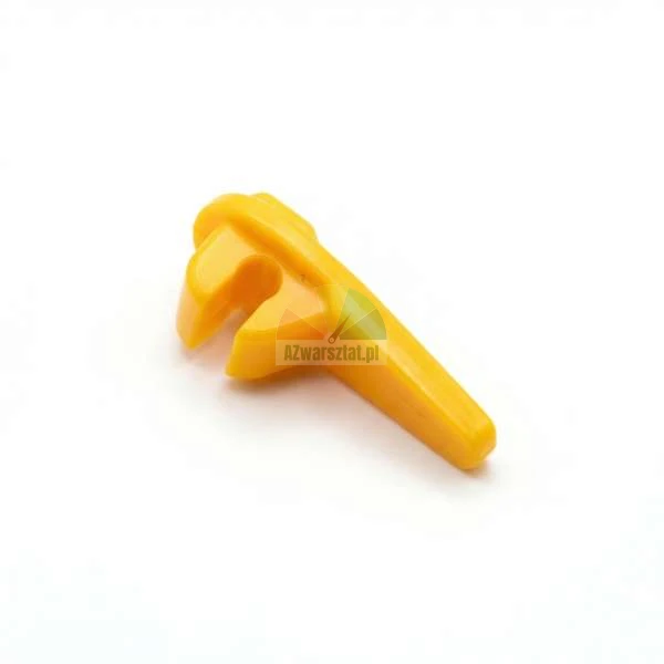 Small yellow plastic open-end wrench, toy tool on a white background.