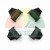 Four black plastic mounting clips arranged symmetrically on a white background