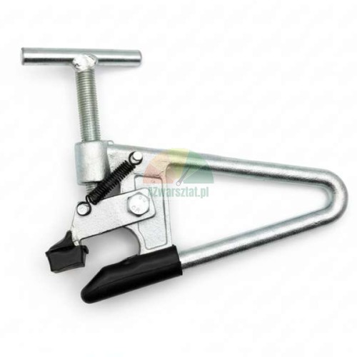 Mounting clamp for aluminum truck wheels with protective rubber pads.