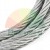 Close-up of a strong steel wire rope coiled on a white background.