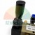 Black hand lever of a pneumatic control valve on a brass body with a model label.