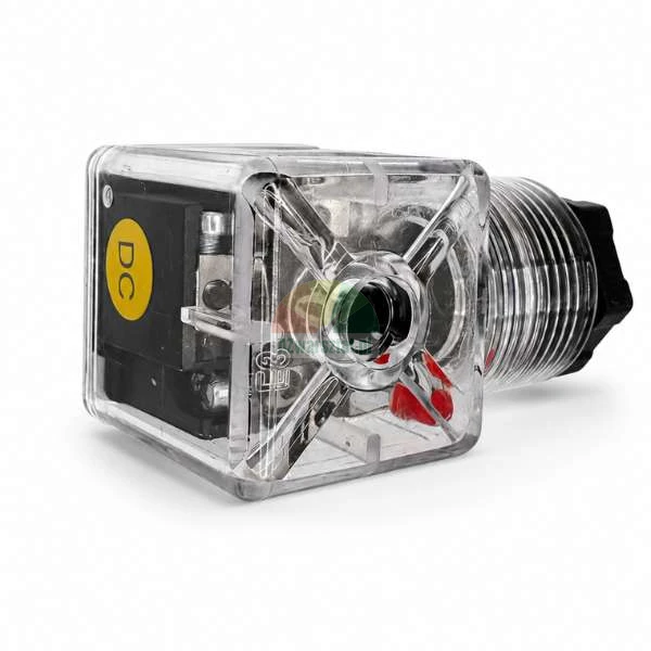 Transparent solenoid valve connector DIN type with a yellow DC label, visible internal contacts and a cable gland.