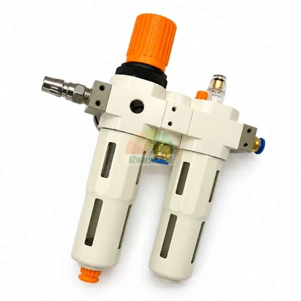 Compressed air preparation unit with filter, regulator, and lubricator, featuring an orange adjustment knob and brass fittings.
