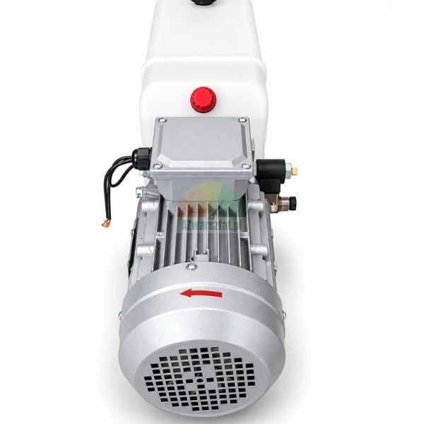 Rear view of an electric motor with cooling fan and oil reservoir tank of a hydraulic power unit on a white background