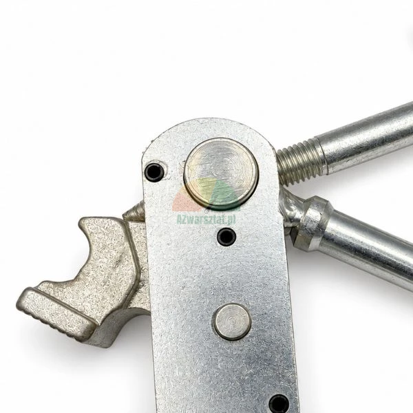 Close-up of a metal tensioner mechanism with a movable clamping shoe and threaded rod.