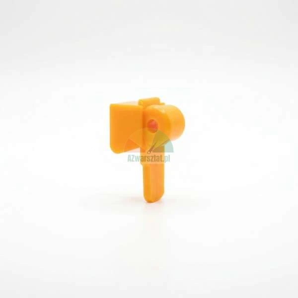 Small orange plastic lever or latch spare part against a white background